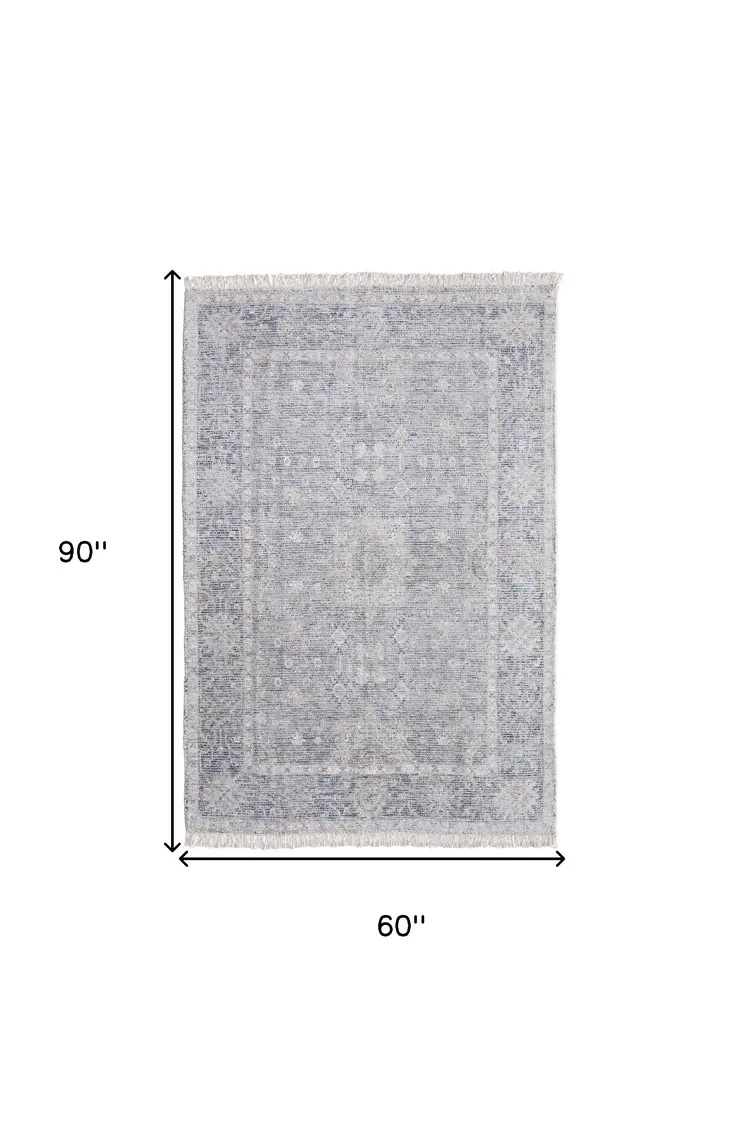 5' X 8' Gray Blue and Taupe Abstract Hand Woven Distressed Area Rug With Fringe