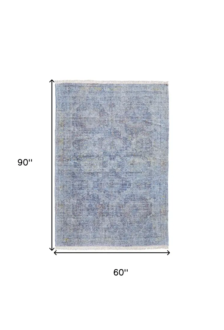 5' X 8' Blue and Ivory Abstract Hand Woven Distressed Area Rug With Fringe