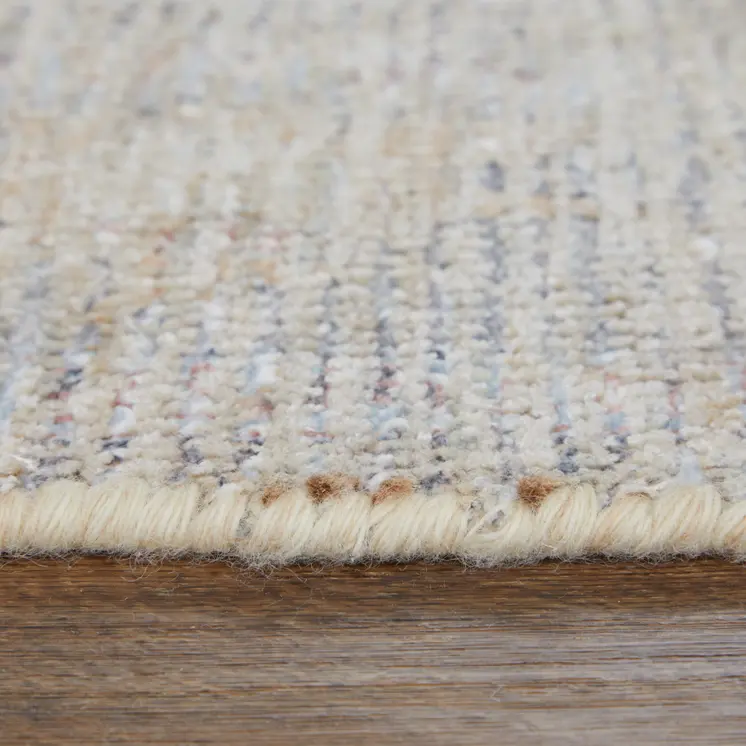 8' X 10' Ivory Tan and Blue Floral Hand Woven Distressed Area Rug With Fringe
