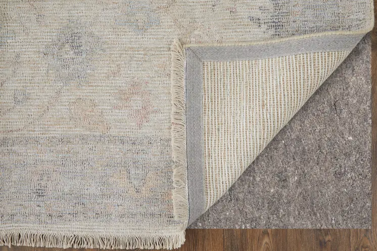 8' X 10' Ivory Tan and Blue Floral Hand Woven Distressed Area Rug With Fringe