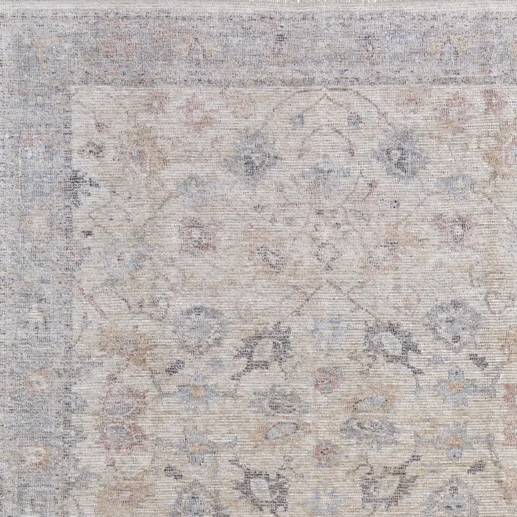 8' X 10' Ivory Tan and Blue Floral Hand Woven Distressed Area Rug With Fringe