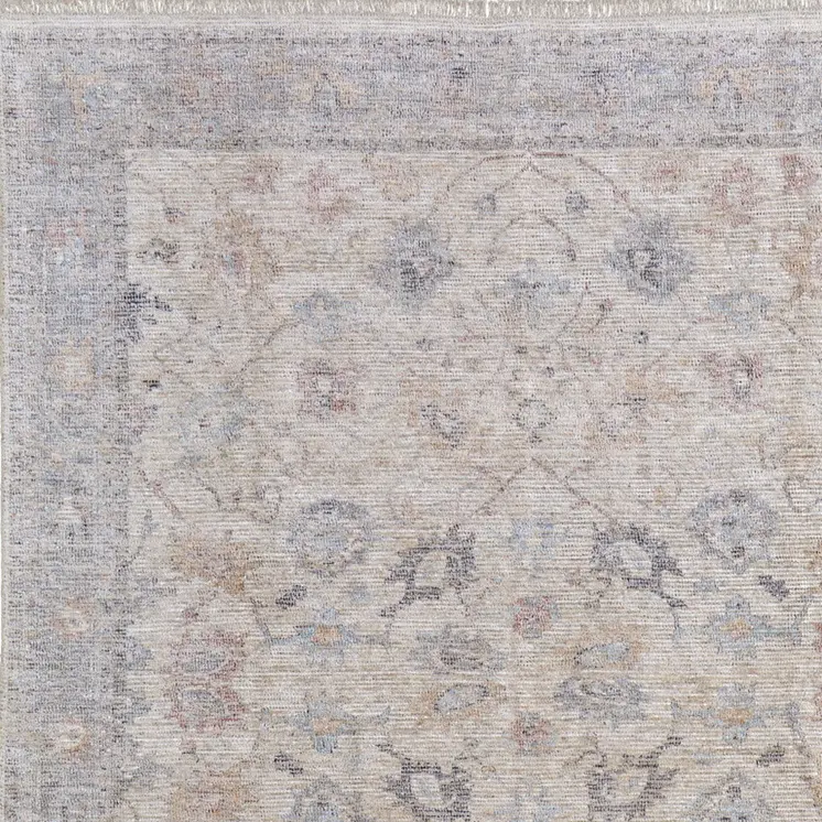 9' X 12' Ivory Tan and Blue Floral Hand Woven Distressed Area Rug With Fringe
