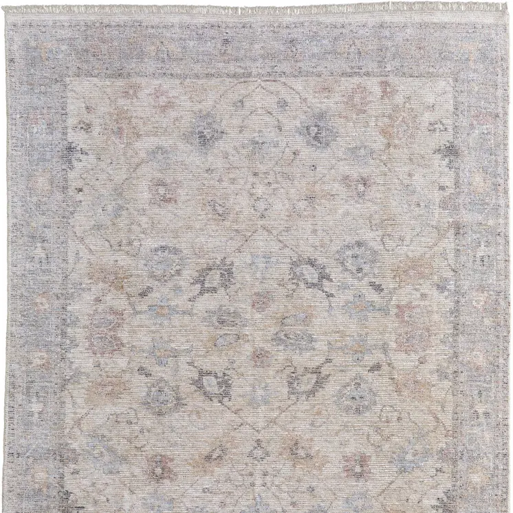 2' X 3' Ivory Tan and Blue Floral Hand Woven Distressed Area Rug With Fringe