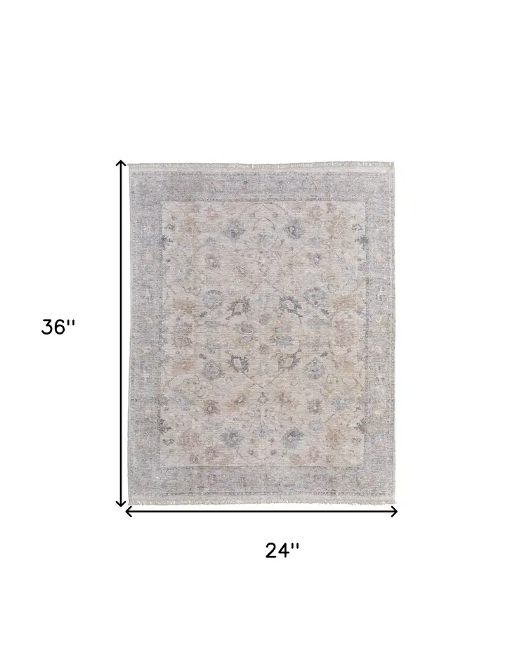 2' X 3' Ivory Tan and Blue Floral Hand Woven Distressed Area Rug With Fringe