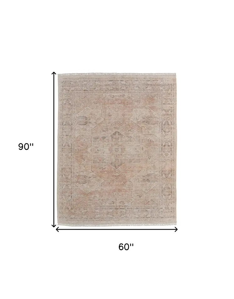 5' X 8' Tan Orange and Ivory Oriental Hand Woven Distressed Area Rug With Fringe