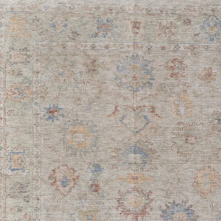 5' X 8' Tan Brown and Blue Floral Hand Woven Distressed Area Rug With Fringe