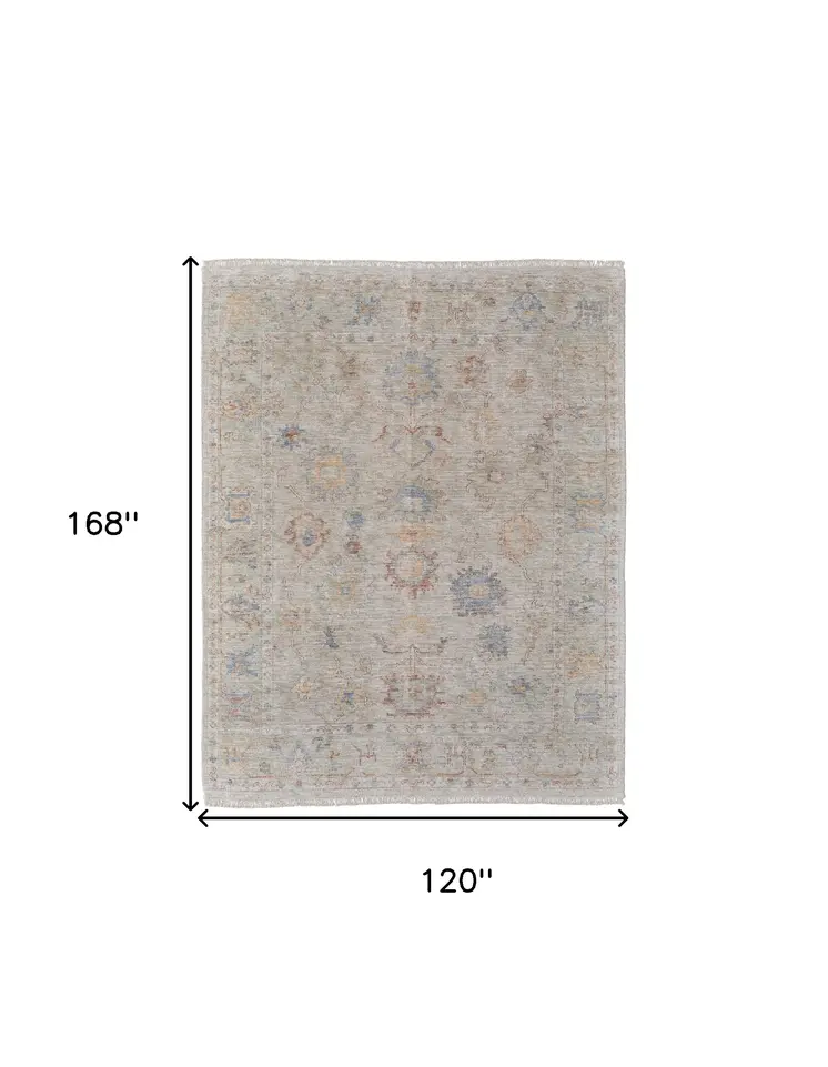 10' X 14' Tan Brown and Blue Floral Hand Woven Distressed Area Rug With Fringe