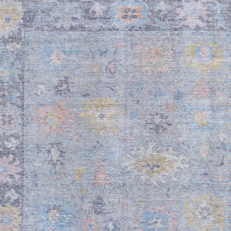 5' X 8' Orange Blue and Gold Floral Hand Woven Distressed Area Rug With Fringe