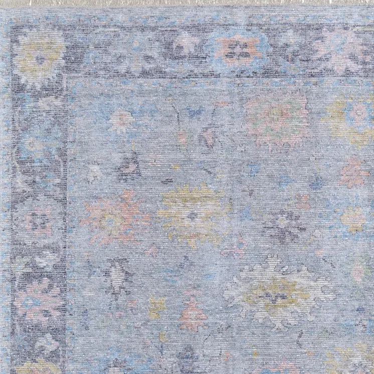 8' X 10' Orange Blue and Gold Floral Hand Woven Distressed Area Rug With Fringe