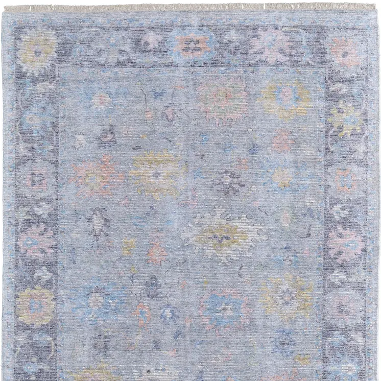 8' X 10' Orange Blue and Gold Floral Hand Woven Distressed Area Rug With Fringe