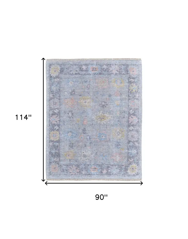 8' X 10' Orange Blue and Gold Floral Hand Woven Distressed Area Rug With Fringe