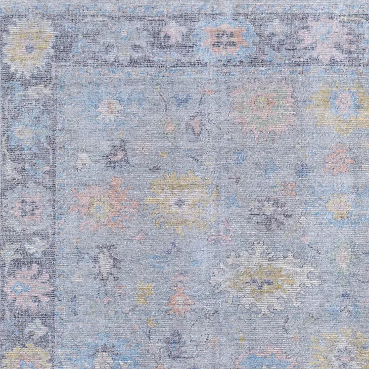 9' X 12' Orange Blue and Gold Floral Hand Woven Distressed Area Rug With Fringe