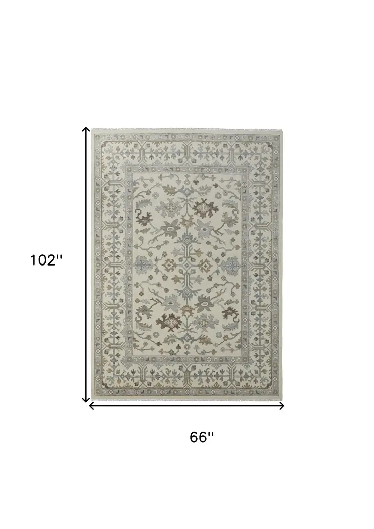 6' X 9' Ivory Gray and Brown Wool Floral Hand Knotted Area Rug With Fringe