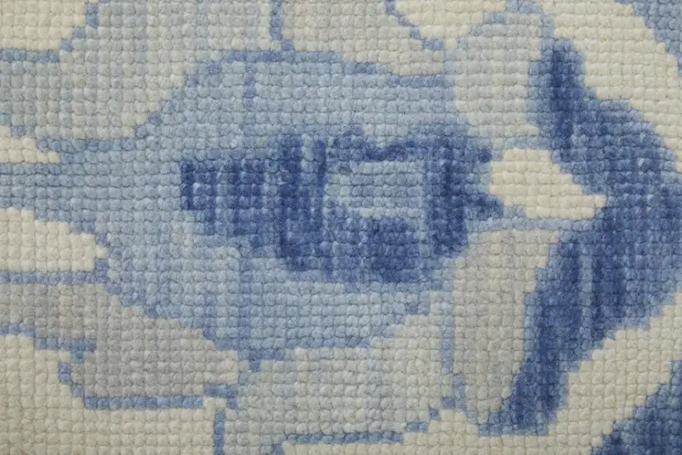 6' X 9' Ivory and Blue Wool Floral Hand Knotted Area Rug With Fringe