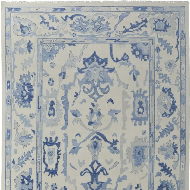 9' X 13' Ivory and Blue Wool Floral Hand Knotted Area Rug With Fringe