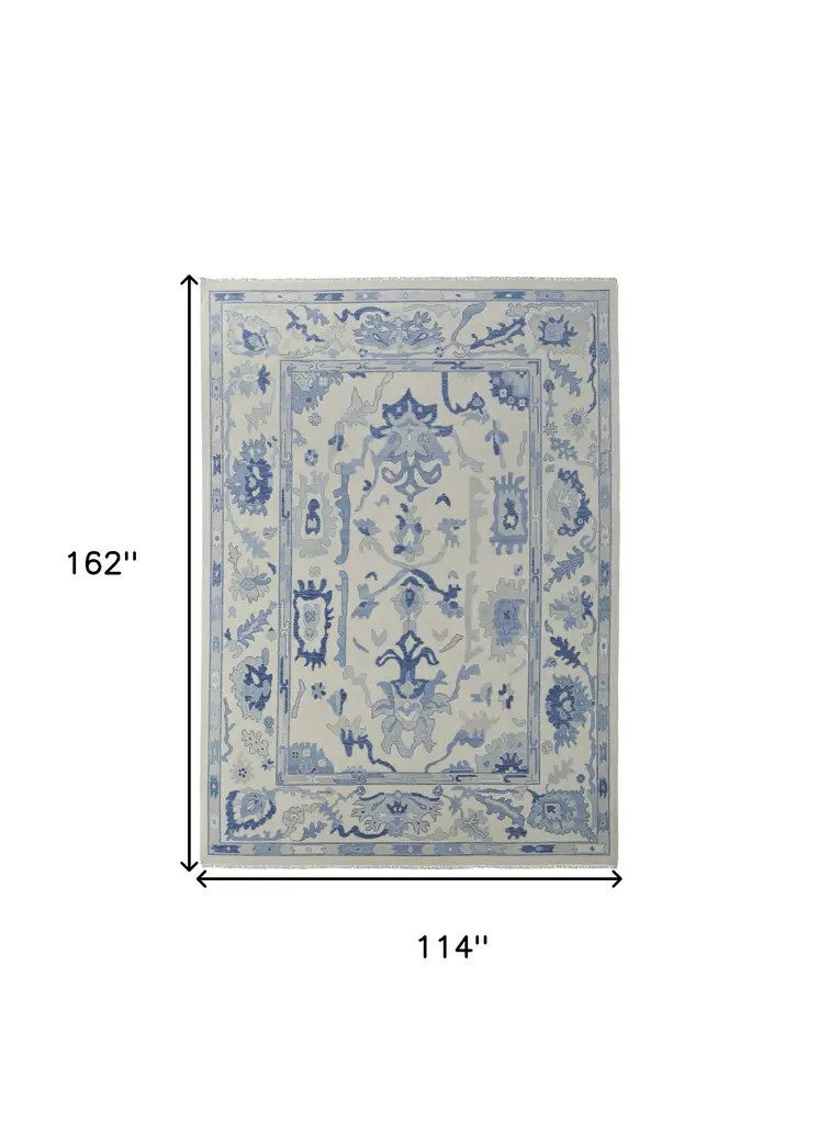 9' X 13' Ivory and Blue Wool Floral Hand Knotted Area Rug With Fringe