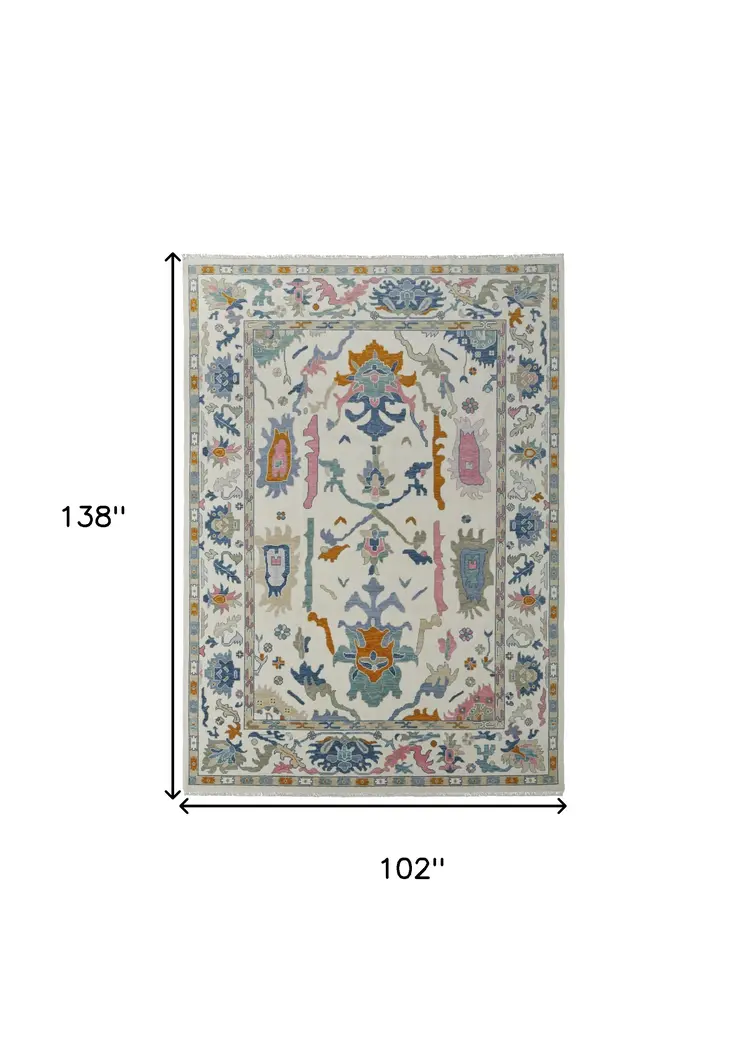 8' X 12' Blue Ivory and Pink Wool Floral Hand Knotted Area Rug With Fringe