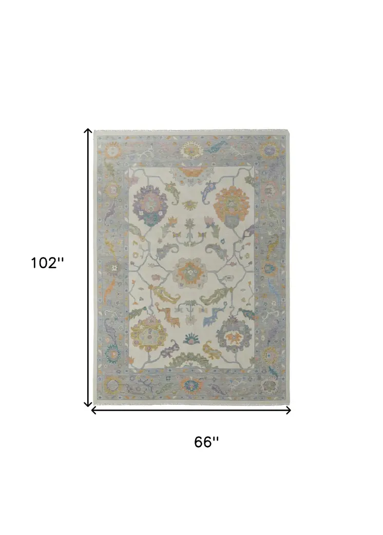 6' X 9' Gray Ivory and Orange Wool Floral Hand Knotted Area Rug With Fringe