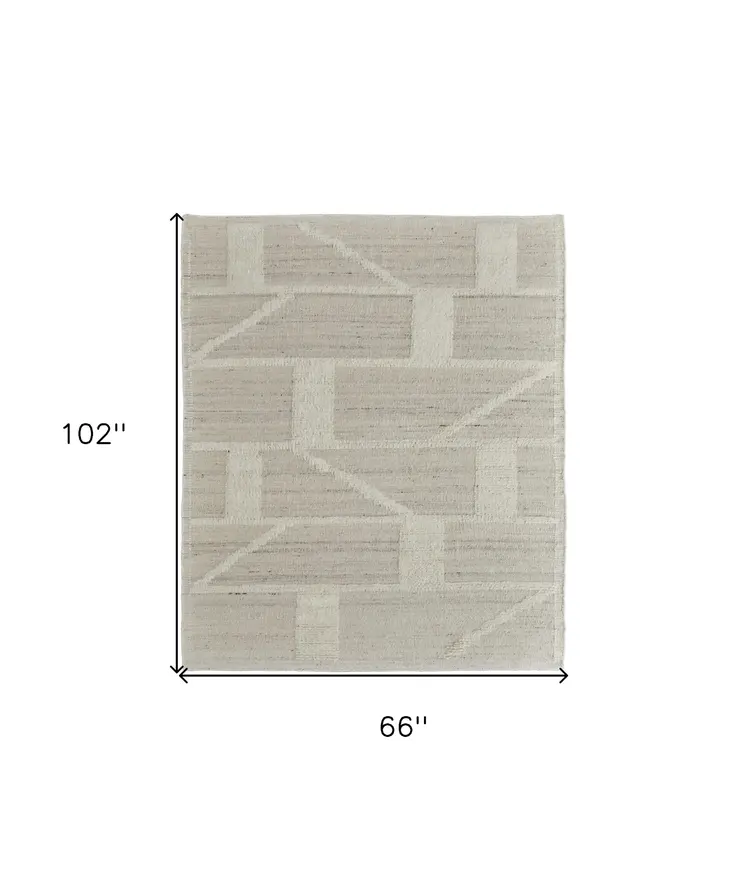 6' X 9' Tan and Ivory Wool Geometric Hand Woven Area Rug