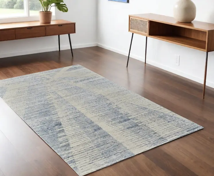 4' X 6' Ivory and Blue Abstract Hand Knotted Worn Faded Area Rug