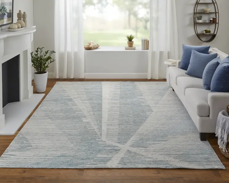 6' X 9' Ivory and Blue Abstract Hand Knotted Worn Faded Area Rug