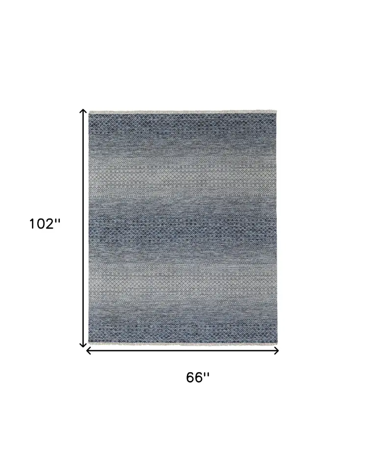 6' X 9' Ivory Gray and Blue Wool Hand Knotted Area Rug With Fringe