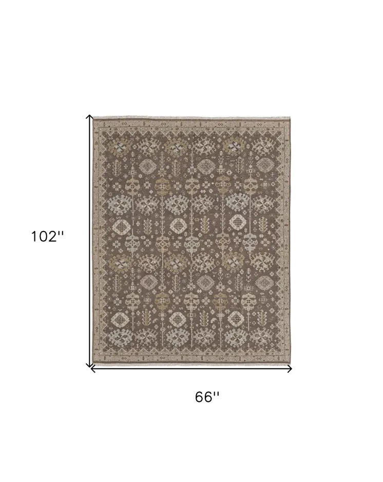 6' X 9' Tan and Brown Wool Oriental Hand Knotted Area Rug With Fringe