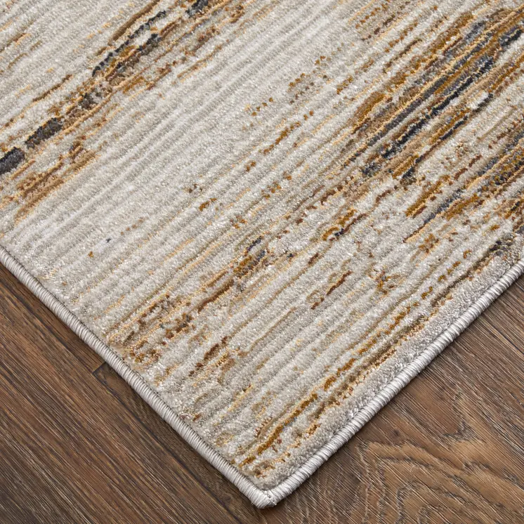 2' X 3' Ivory and Tan Abstract Power Loom Worn Faded Area Rug