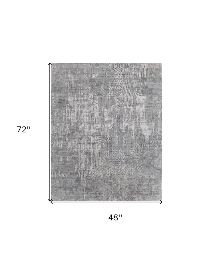 4' X 6' Gray and Silver Abstract Hand Woven Worn Faded Area Rug