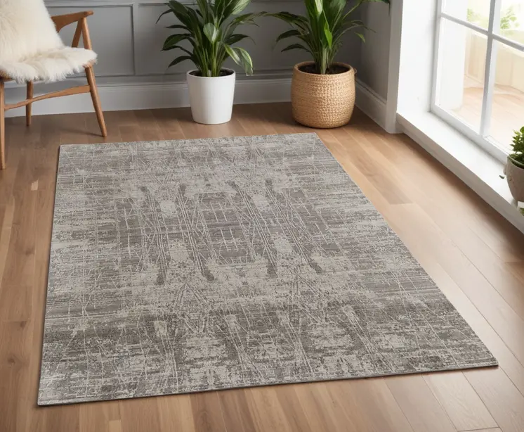 4' X 6' Gray and Silver Abstract Hand Woven Worn Faded Area Rug