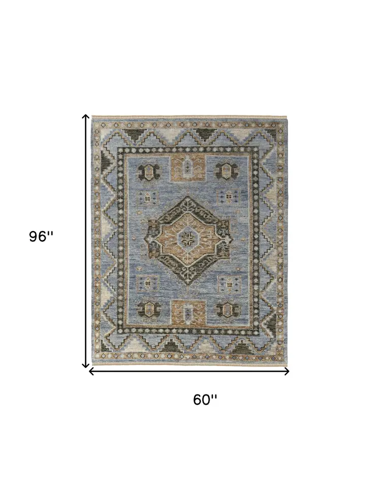 5' X 8' Ivory Tan and Blue Wool Oriental Hand Knotted Area Rug With Fringe