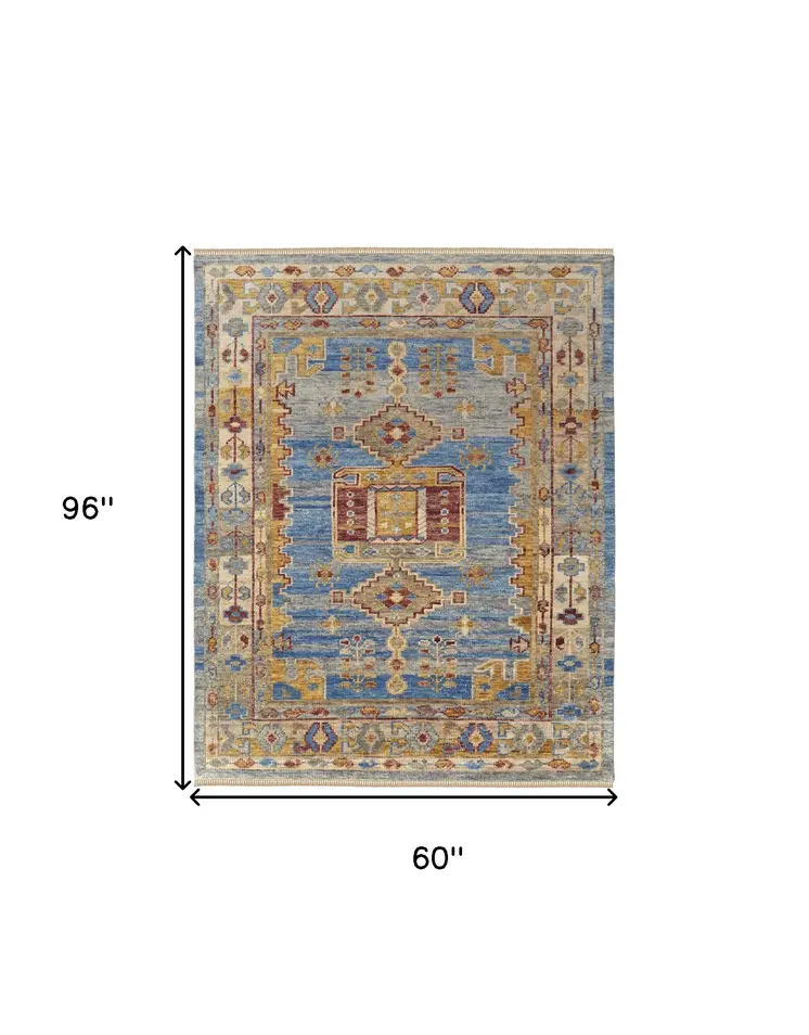 5' X 8' Blue Red and Yellow Wool Geometric Hand Knotted Area Rug With Fringe