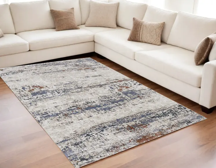 5' X 8' Gray Blue and Ivory Abstract Power Loom Area Rug