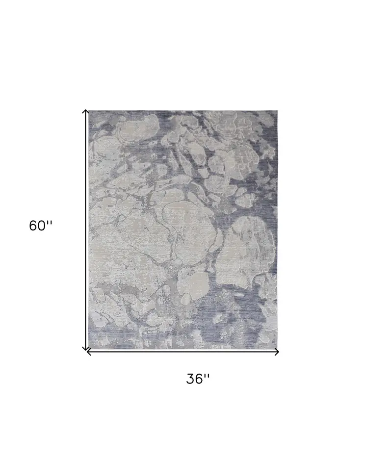 3' X 5' Ivory and Blue Abstract Power Loom Worn Faded Area Rug