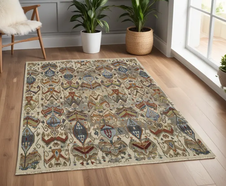 4' X 6' Ivory Blue and Brown Wool Ikat Hand Knotted Area Rug With Fringe