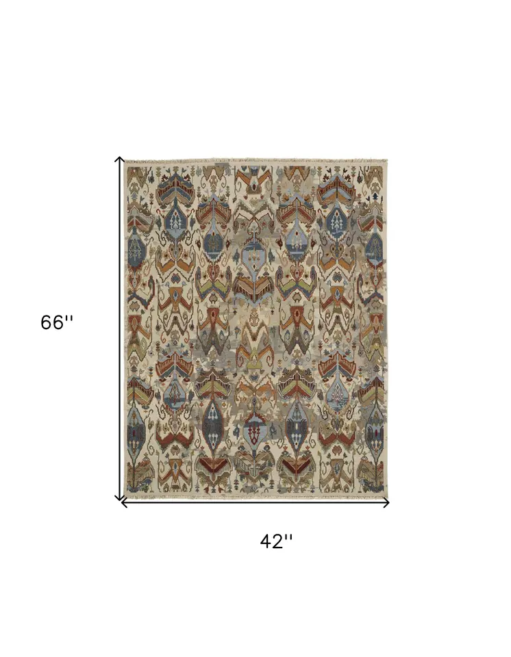 4' X 6' Ivory Blue and Brown Wool Ikat Hand Knotted Area Rug With Fringe