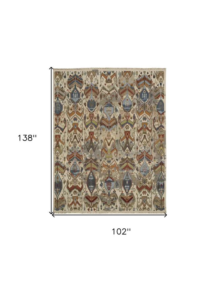 8' X 12' Ivory Blue and Brown Wool Ikat Hand Knotted Area Rug With Fringe