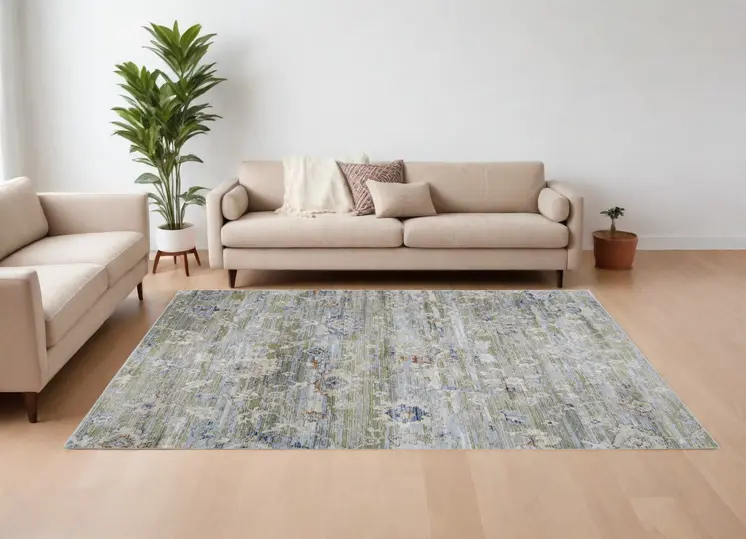 8' X 10' Ivory Green and Blue Floral Power Loom Worn Faded Area Rug