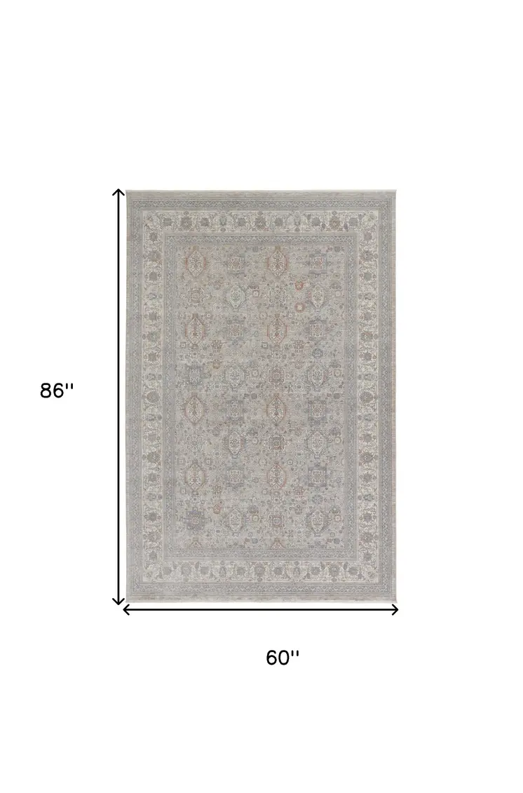 5' X 7' Silver Taupe and Blue Oriental Power Loom Worn Faded Area Rug With Fringe