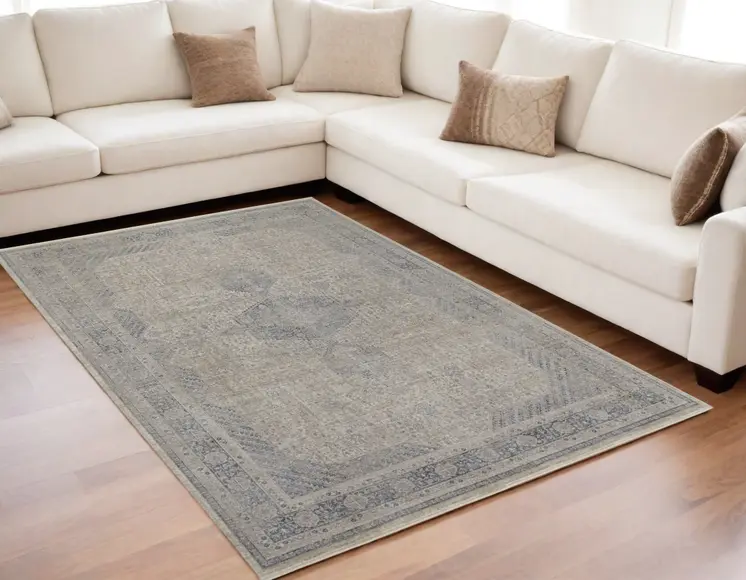 5' X 7' Gray Blue and Taupe Oriental Power Loom Worn Faded Area Rug With Fringe