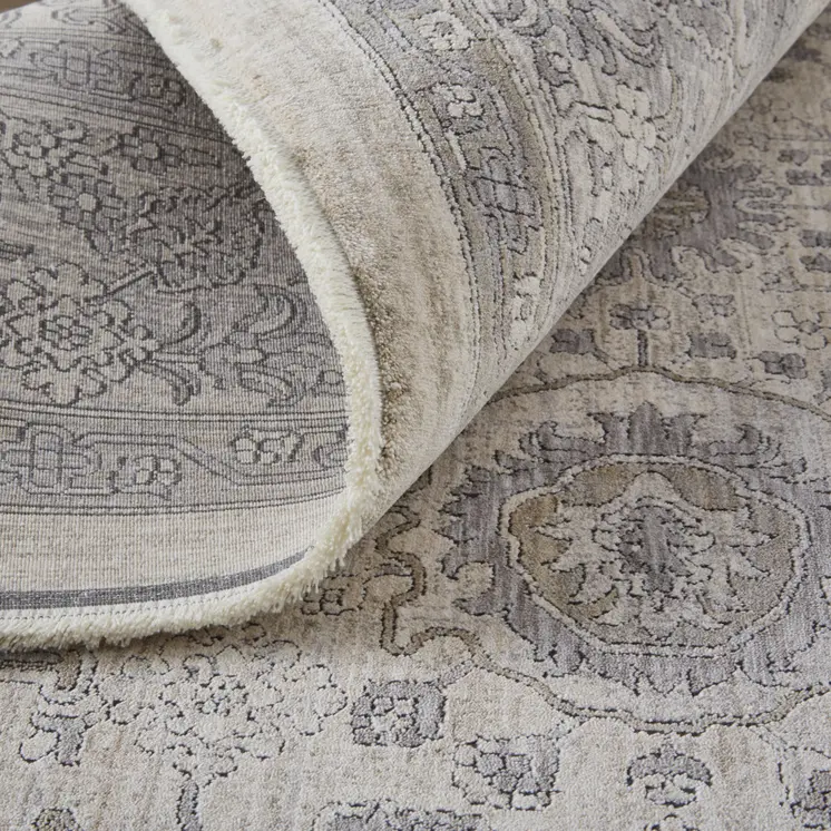 4' X 5' Gray and Ivory Oriental Power Loom Worn Faded Area Rug With Fringe
