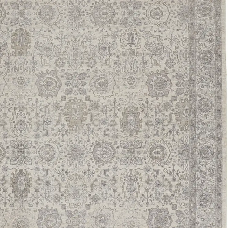5' X 7' Gray and Ivory Oriental Power Loom Worn Faded Area Rug With Fringe