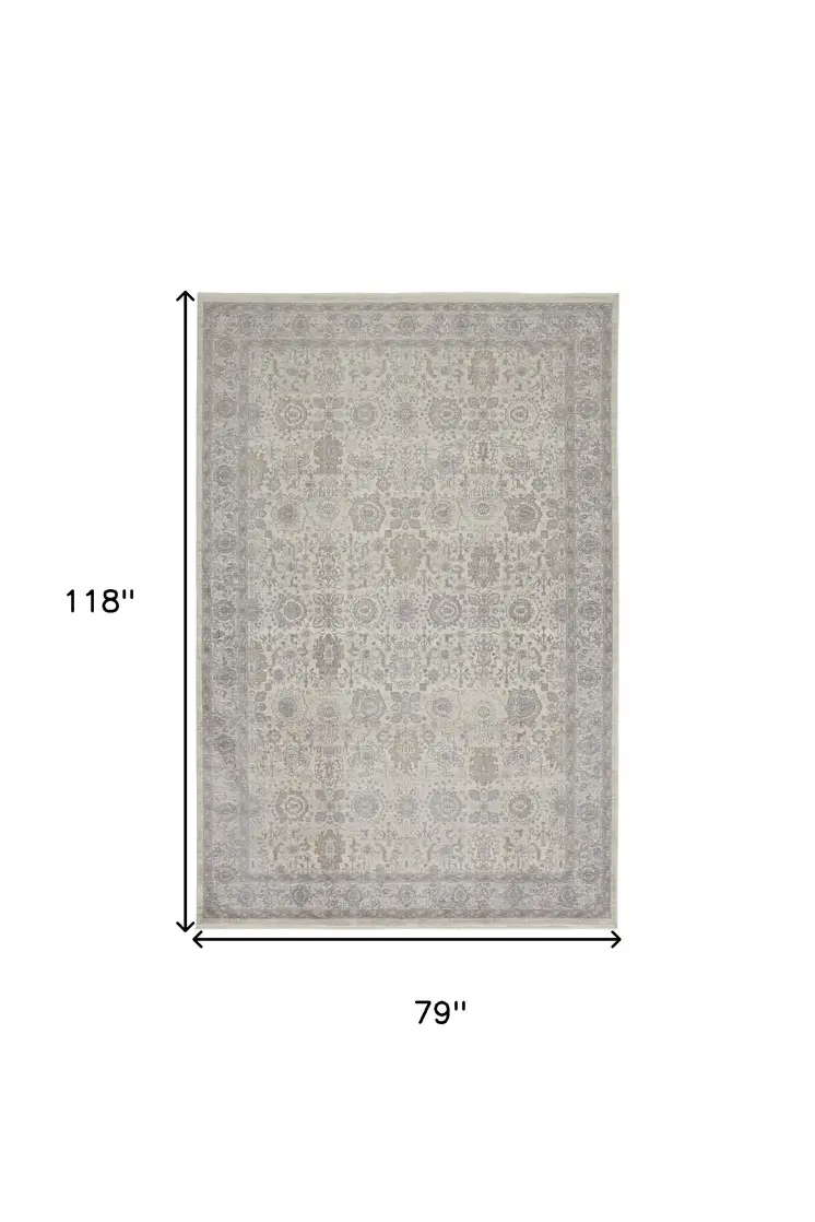 7' X 10' Gray and Ivory Oriental Power Loom Worn Faded Area Rug With Fringe