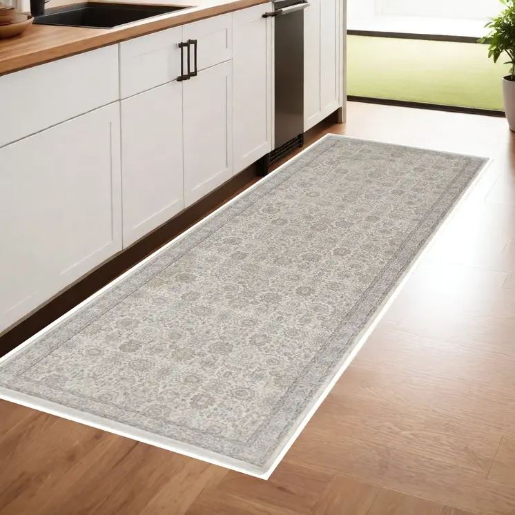 8' Gray and Ivory Oriental Power Loom Worn Faded Runner Rug With Fringe