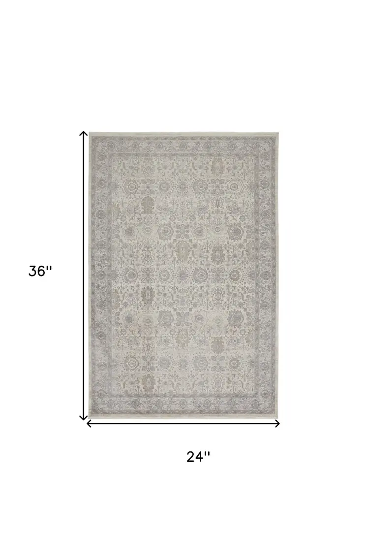 2' X 3' Gray and Ivory Oriental Power Loom Worn Faded Area Rug With Fringe