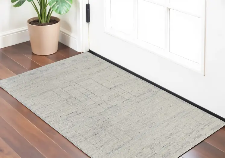 2' X 3' Gray and Ivory Abstract Hand Woven Worn Faded Area Rug