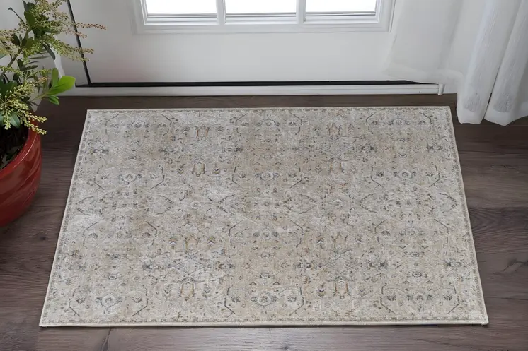 2' X 3' Ivory Taupe and Blue Abstract Power Loom Worn Faded Area Rug With Fringe