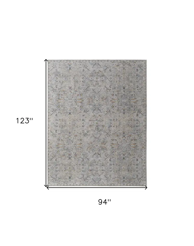 8' X 10' Ivory Tan and Blue Abstract Power Loom Worn Faded Area Rug With Fringe
