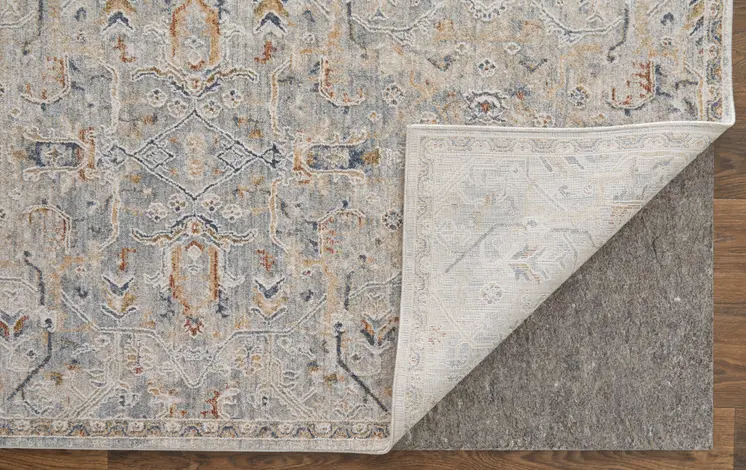 9' X 13' Ivory Tan and Blue Abstract Power Loom Worn Faded Area Rug With Fringe