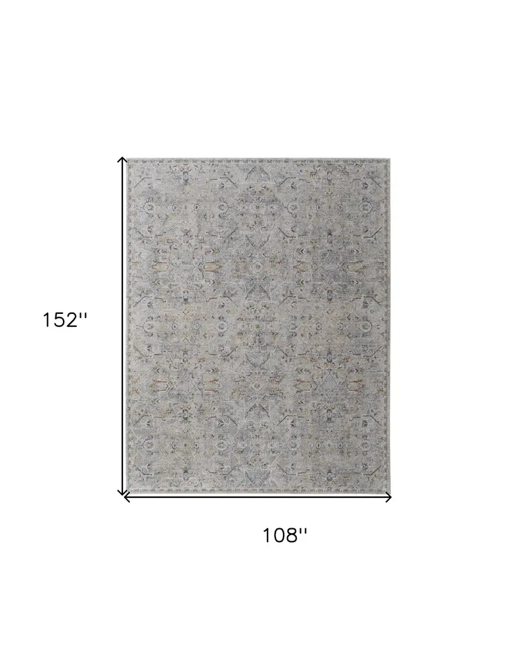 9' X 13' Ivory Tan and Blue Abstract Power Loom Worn Faded Area Rug With Fringe